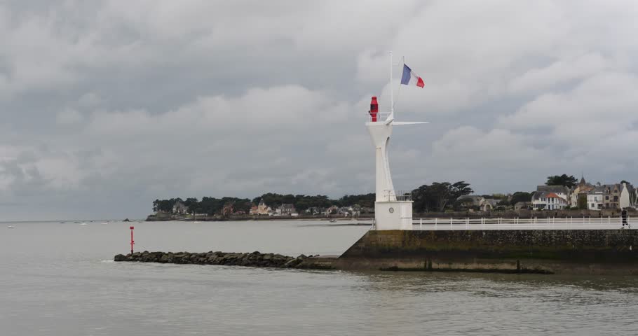 A view of le Pouliguen lighthouse on a cloudy day. Le Pouliguen, France - April 27, 2024.