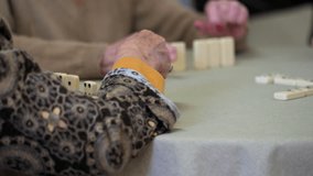 Close up of a group of elderly woman playing Domino. High Quality 4k video