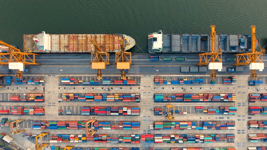 Container ships and lifting cranes in the Port in Bangkok Thailand. Aerial view by drone 4k camera. Royalty-Free Stock Footage #34906150
