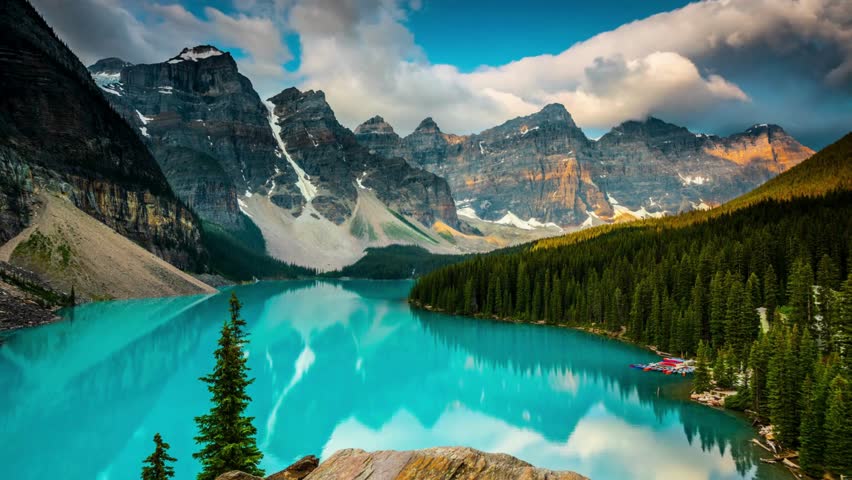 Golden Hour Magic: Time-Lapse Sunset Over Ten Peaks at Moraine Lake, Banff National Park, Alberta, Canada - Captured in Exquisite 4K Video Royalty-Free Stock Footage #3490638369
