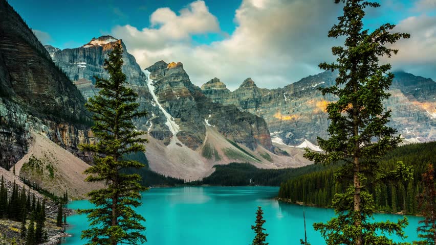 Golden Hour Magic: Time-Lapse Sunset Over Ten Peaks at Moraine Lake, Banff National Park, Alberta, Canada - Captured in Exquisite 4K Video Royalty-Free Stock Footage #3490638977