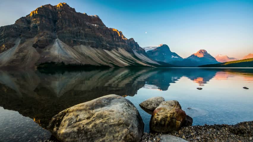 Golden Tranquility: Sunset at Bow Lake in the Canadian Rockies, Banff National Park, Alberta, Canada - Captured in Serene 4K Video Royalty-Free Stock Footage #3490641245