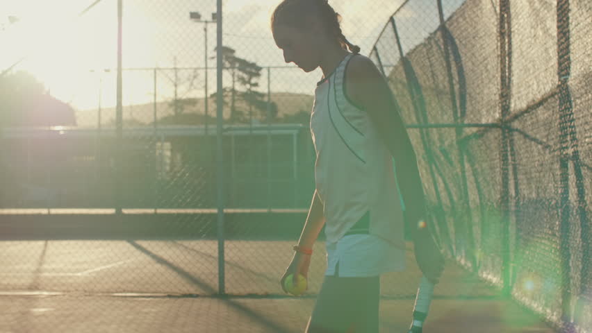 Fit healthy sporty teenager playing tennis, getting ready to serve on court slow motion with sun flare Royalty-Free Stock Footage #34906504