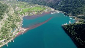 antalya Kizkumu aerial drone video blue sea cloudy sky settlement port and peninsula