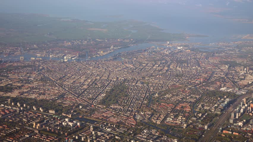 Aerial view of downtown city center of Amsterdam, Dutch capital in Holland the Netherlands. With canals and historic town, houses and water way