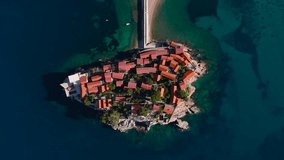 Sveti Stefan is an amazing island resort in Montenegro on the Adriatic coast, with white beaches, luxury hotels and picturesque streets. One of the most romantic places in Montenegro. 4k drone video. 