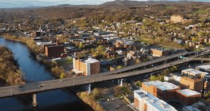 Late afternoon spring aerial video of downtown Troy, NY located on the Hudson River.