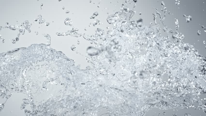 Super Slow Motion Shot of Pure Water Splashes Flying Towards on Gradient Background at 1000fps.