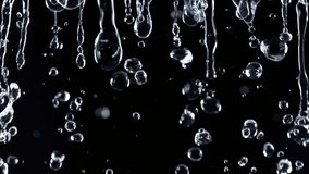Super Slow Motion Shot of Falling Water Droplets Isolated on Black Background at 1000 fps. - Powered by Shutterstock - Get 15% off with code: PIKWIZARD15