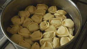 Ravioli pasta in a saucepan close up 4K stock footage
