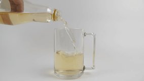 Fruit juice from a plastic bottle is poured into a glass. Slow motion - Powered by Shutterstock - Get 15% off with code: PIKWIZARD15