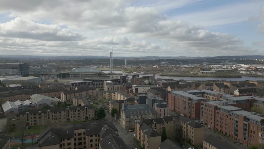 Scotland Glasgow Skyline with famous Glasgow landmarks, The OVO Hydro, SEC Armadillo and Finnieston Crane. Wide Aerial Backward. gorgeous view