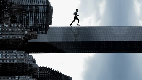 man running in slow motion. powerful superhero. success. successful. career confident. business. epic amazing. skyline city urban style