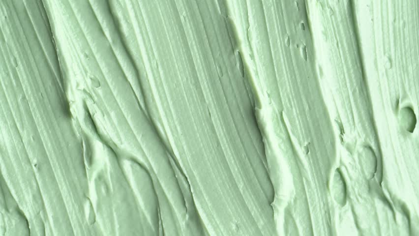 Texture of green clay mask. Swatch of clay mask, rotation