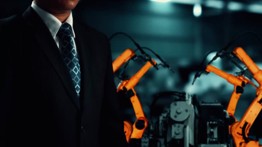 MLP Engineer use cybernated robotic software to control industry robot arm in factory. Automation manufacturing process controlled by specialist using IOT software connected to internet network. Royalty-Free Stock Footage #3491240837