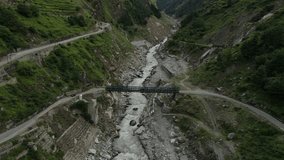 Aerial Drone shot of a black car crossing a river in the mountains of Uttarakhand. - Powered by Shutterstock - Get 15% off with code: PIKWIZARD15