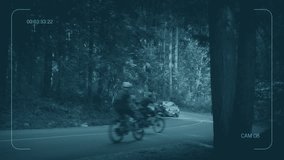 CCTV Cyclists Pass Car On Forest Road - Powered by Shutterstock - Get 15% off with code: PIKWIZARD15
