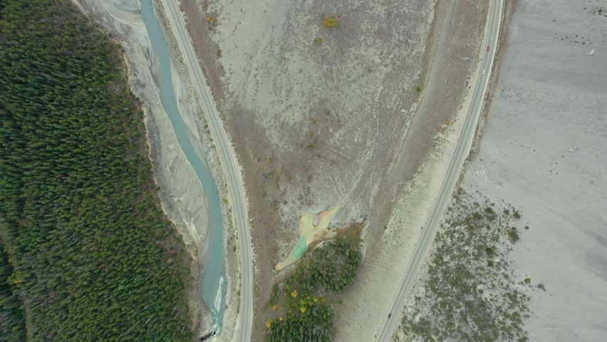 Spectacular aerial view with cars crossing the curve at The Big Bend on the Icefield Parkway, Canadian Rockies.