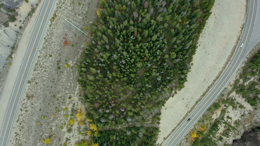 Spectacular aerial view with cars crossing the curve at The Big Bend on the Icefield Parkway, Canadian Rockies.