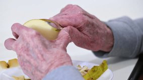 Close up of an elderly man having lunch at nursing home. High quality 4k video 