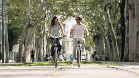 Video of of happy loving couple cycling while looking each other in the city - Powered by Shutterstock - Get 15% off with code: PIKWIZARD15