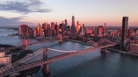 Establishing Aerial View Shot of New York City NY, NYC, United States, Brooklyn Bridge, Manhattan Bridge, Downtown Manhattan, sunrise, wonderful colours
