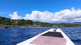 Boat drives in the sea waters on Karampuang Island, Mamuju, West Sulawesi, Indonesia