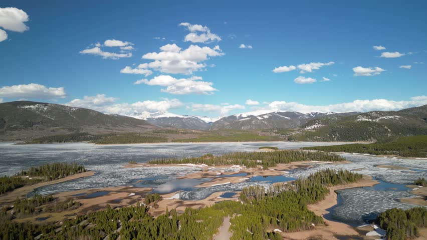 Aerial of frozen Lake Dillon in Silverthorne Colorado in springtime