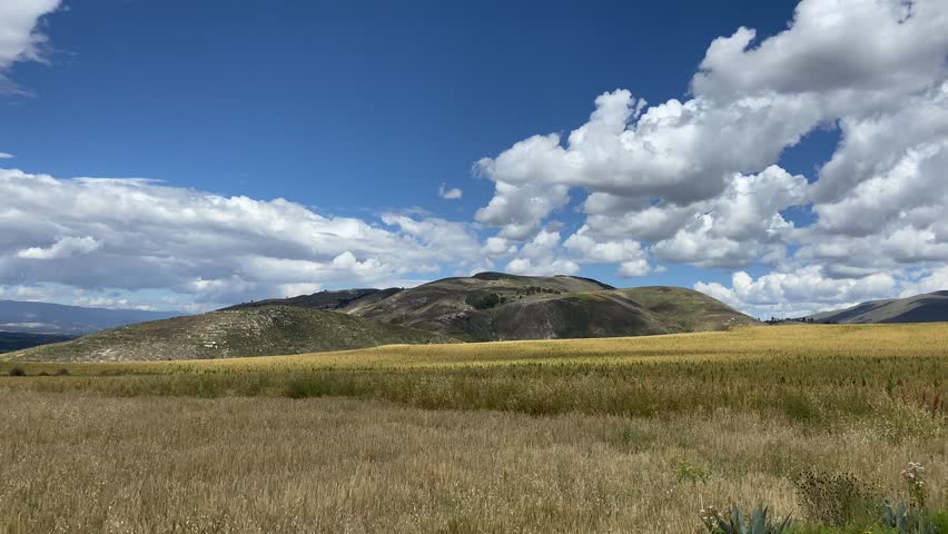 Landscape video of a valley with mountains and fields of quinoa and barley. Huancayo, Perú.