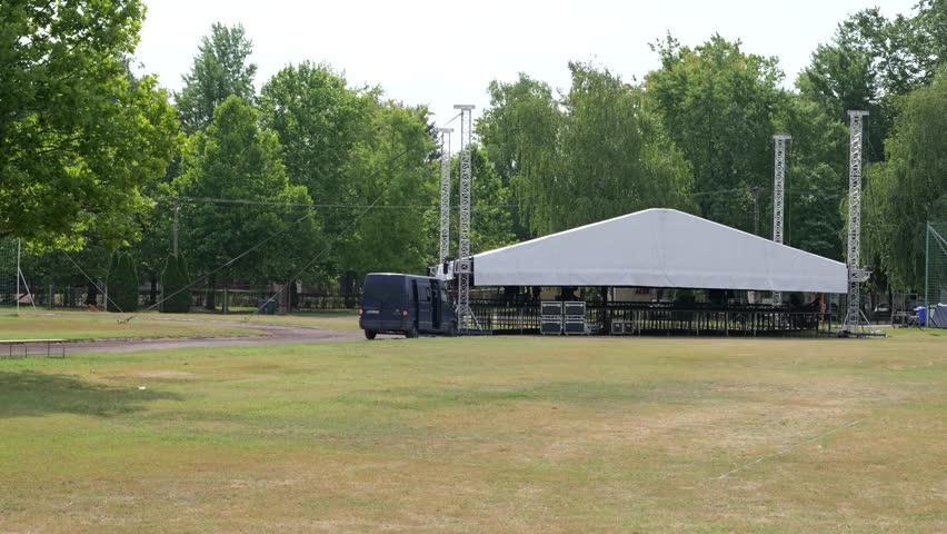 Construction Of Outdoor Concert Stage Tent With Truss Frame Structure In Kunfeherto, Hungary. - wide shot