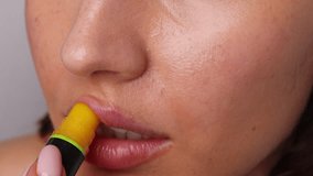 woman portrait applying bio natural face, hand cream, serum.smiling girl putting lotion on nose,use lip balm.portrait of female using safe products for skincare,homemade.no makeup.4k video - Powered by Shutterstock - Get 15% off with code: PIKWIZARD15