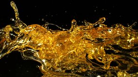 Super Slow Motion Shot of Oil Splashes Flying Towards Isolated on Black Background at 1000fps. - Powered by Shutterstock - Get 15% off with code: PIKWIZARD15