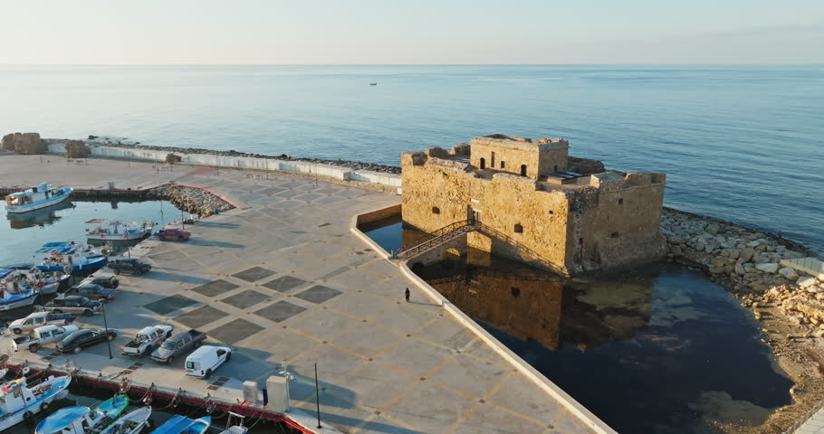 Aerial view of the fort in the castle of Paphos, Cyprus. A fort in the surrounded waters of the Mediterranean Sea on a tourist island. High quality 4k footage