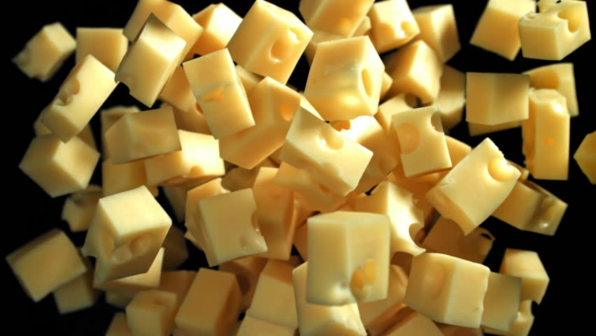 Super slow motion pieces of cheese on black background. Filmed on a high-speed camera at 1000 fps. High quality FullHD footage