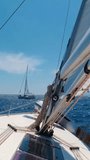 Sailing Towards Maritime Adventures in the Open Sea on a Yacht. Summer Vacation and Yachting Sport. Vertical Video