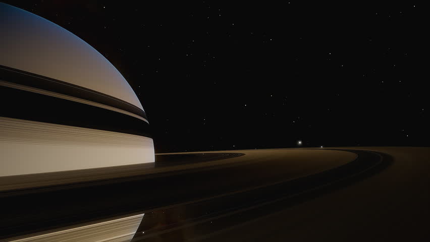 The rings of the planet Saturn and several moons of the planet Saturn in orbit around it.