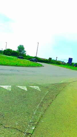 Cars are running on the wide Road with green Grass Natural Beauty