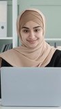 Friendly Arabian Female Entrepreneur Using Laptop In The Office