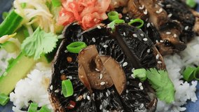 Korean mushrooms bowl with cucumber salad, kimchi and rice. Rotating video