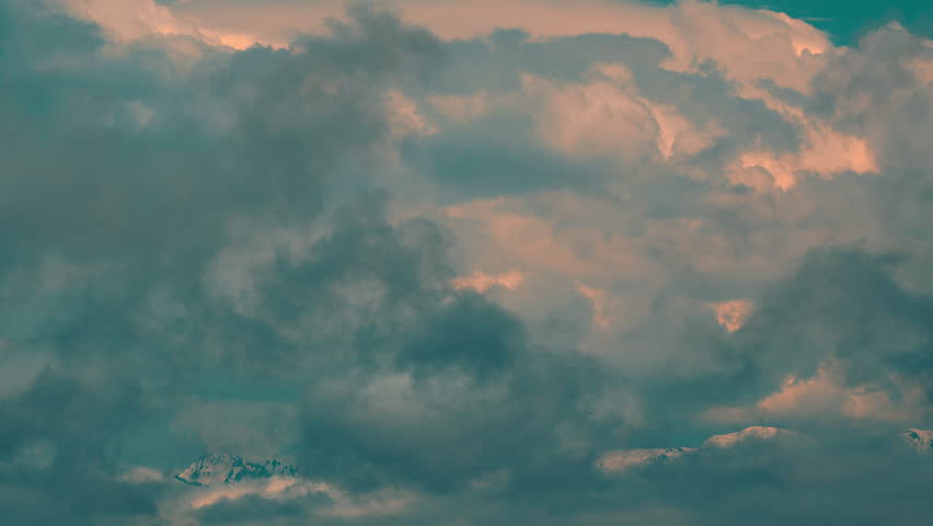 Overcast Clouds Moving On Snowcapped Mountain Peaks During Winter. Snow Covered Mountain In A Snow Storm.