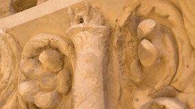 The sculptures on the white wall of the castle in one of the ruins in Palatino in Rome in Italy - Powered by Shutterstock - Get 15% off with code: PIKWIZARD15