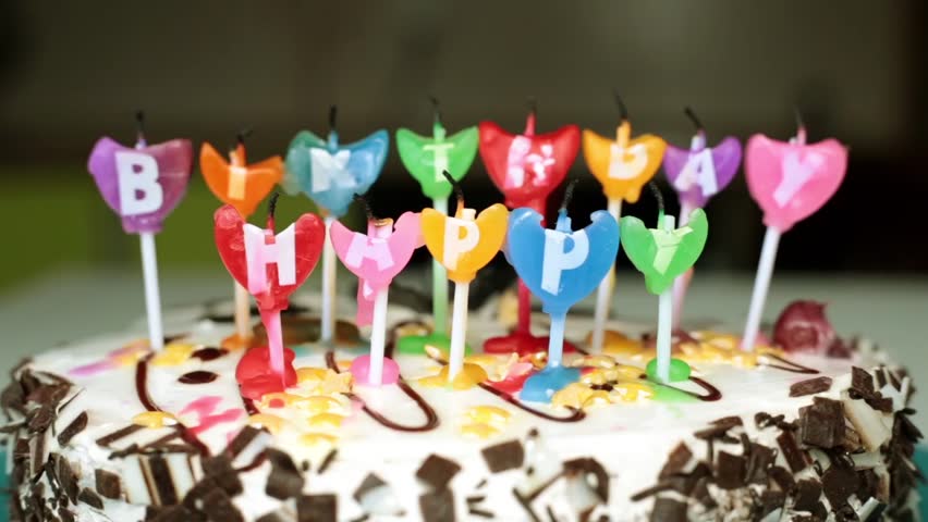 Light the candles on the cake. Holiday, birthday.