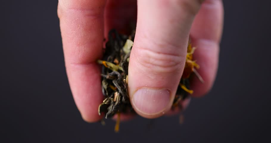 green tea with berries and flowers, delicious dry tea with additives for taste and aroma