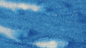 Shimmering ink flow. Fluid pouring. Shiny glowing blue white color metallic texture acrylic paint flow on blur art abstract background. - Powered by Shutterstock - Get 15% off with code: PIKWIZARD15