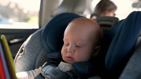 a child in a car seat. Emphasizing the journey of childhood, safety milestones, and growing independence, this video connects with parents and families alike. Perfect for family-oriented promotions, c