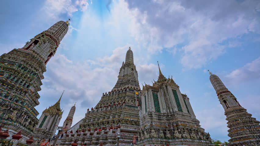 Time lapse of the great pagodas richly decorated at Wat Arun. pagoda is Thai architecture applied in Chinese style. Decorated with glazed tiles and Multicolor wares. Wat Arun landmark in Bangkok. 
