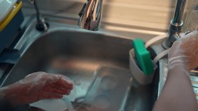 People washing hands from faucet at sink in the kitchen - Powered by Shutterstock - Get 15% off with code: PIKWIZARD15