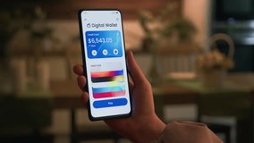 Paying online with a credit card using digital wallet on the smartphone. Choosing from different credit cards for contactless payment. - Powered by Shutterstock - Get 15% off with code: PIKWIZARD15
