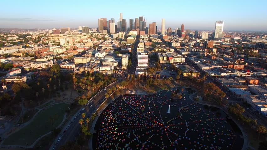 Aerial Tilt Down Shot Of Multi Colored Macarthur Park In Modern City - Los Angeles, California