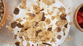 Super slow motion of falling cereal pieces into milk, camera movement and rotation. Filmed on high speed cinema camera at 1000fps. - Powered by Shutterstock - Get 15% off with code: PIKWIZARD15